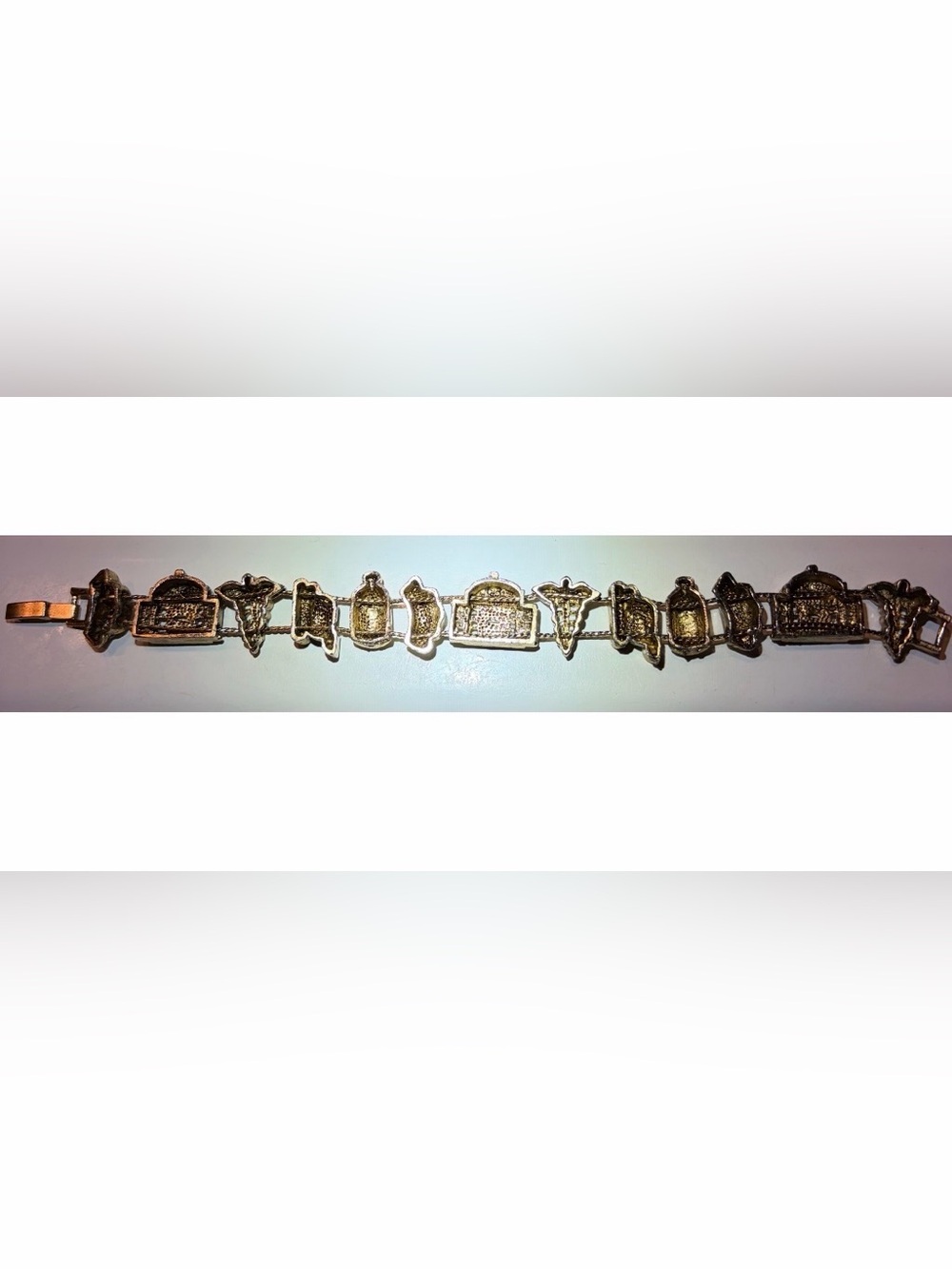Vintage Gold-Tone Womenโs Slide Charm Bracelet with Iconic Nursing Charms